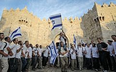 Thousands of Jews wave Israeli flags as they celebrate Jerusalem Day by walking the streets of Jerusalem, through Damascus Gate on their way to the Western Wall on May 20, 2012. (Nati Shohat/Flash90)