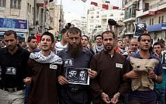 Protesters call for the release of Palestinian prisoners during a demonstration in Ramallah in May. (photo credit: Issam Rimawi/Flash90)