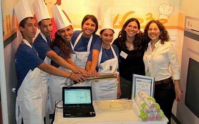 MamaBaker staff show off the Flour n'Roll (Photo credit: Courtesy)
