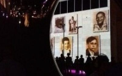 Reflected photos of world leaders on the Anish Kapoor sculpture (photo credit: Jessica Steinberg)