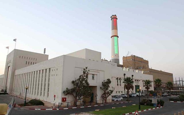 The Reading power plant lit up with the national power consumption graph. (photo credit: Chen Leopold/Energy Ministry)