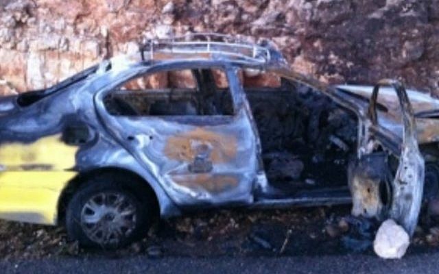 A burnt-out Palestinian taxi in the wake of a firebombing attack near the settlement of Bat Ayin (photo credit: Israel Police) A burnt-out Palestinian taxi in the wake of a firebombing attack near the settlement of Bat Ayin (photo credit: Israel Police)