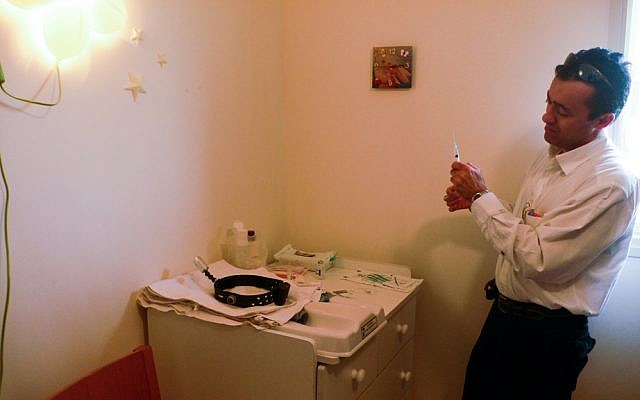 Getting ready to perform a circumcision. (illustrative photo: CC-BY Ran Yaniv Hartstein, Flickr)