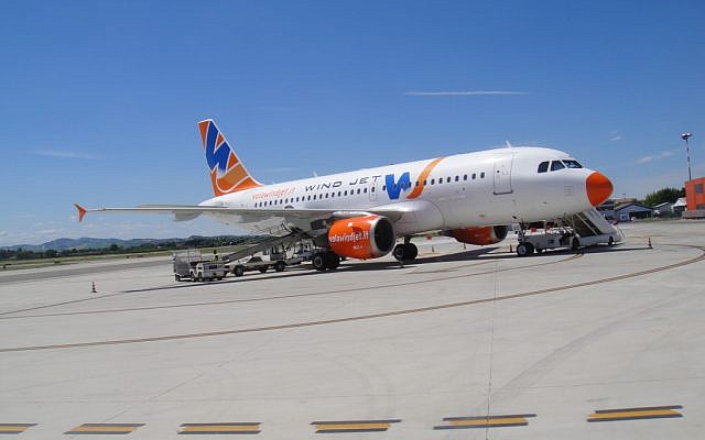 A Wind Jet plane on the tarmac. (photo credit: CC-BY francescomucio, Flickr) A Wind Jet plane on the tarmac. (photo credit: CC-BY francescomucio, Flickr)