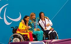 Israeli swimmer Inbal Pezaro, right, holds the bronze medal she won in the 50 meter freestyle event at the 2012 Paralympic Games in London on Thursday, August 30, 2012. (photo credit: Razi Livnat)
