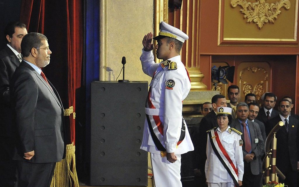 Mohammed Morsi at a graduation ceremony at the Police Academy headquarters in Cairo, July 14 (photo credit: AP Photo/Ahmed Mourad) Mohammed Morsi at a graduation ceremony at the Police Academy headquarters in Cairo, July 14 (photo credit: AP Photo/Ahmed Mourad)