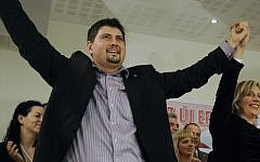 Csanad Szegedi celebrating his entry into the European Parliament after the European parliamentary election in Budapest, Hungary in 2009. (photo credit: AP Photo/Bela Szandelszky, File)