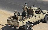Egyptian army personnel guard the road outside Rafah, Egypt, Monday, Aug. 6, (photo credit: AP)