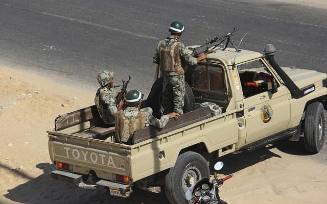 Egyptian army personnel guard the road outside Rafah, Egypt, Monday, Aug. 6, (photo credit: AP)