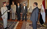 Egyptian President Mohammed Morsi swears in Minister of Defense, Lt. Gen. Abdel-Fattah el-Sissi August 12 (photo credit: AP photo)