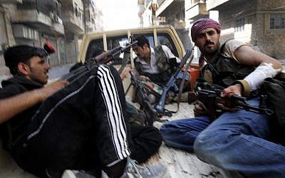 Rebels in Aleppo last week. (photo credit: AP/Alberto Prieto)