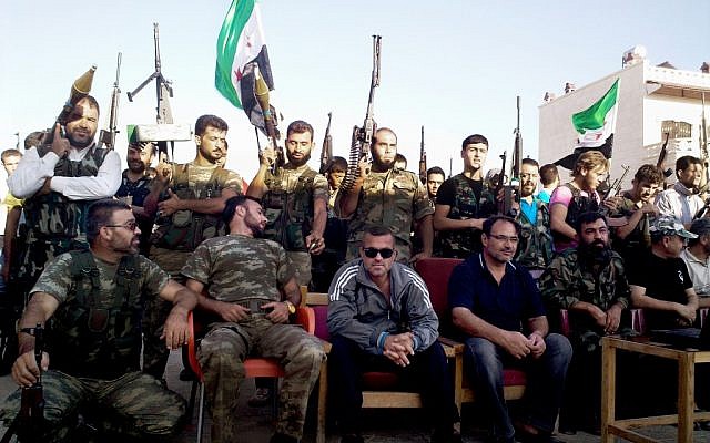 Free Syrian Army soldiers pose for a photograph in Sarmada, northern Syria, on Sunday, Aug. 12, 2012. (photo credit: Shaam News Network/AP) Free Syrian Army soldiers pose for a photograph in Sarmada, northern Syria, on Sunday, Aug. 12, 2012. (photo credit: Shaam News Network/AP)