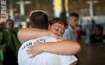Alex Shatilov receives a hug from his mother on his way to the 2012 Games in London (photo credit: courtesy of the Israeli Olympic Committee)
