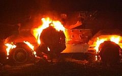 An Egyptian armored vehicle commandeered by terrorists burning at the Kerem Shalom crossing August 5. (photo credit: @AvitalLeibovich, Twitter)
