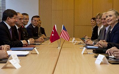 US Secretary of State Hillary Rodham Clinton, at far right, meets with Turkey's Foreign Minister Ahmet Davutoglu, at far left, in Istanbul in early August (photo credit: AP/Jacquelyn Martin, Pool)