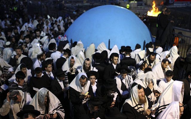 Ultra-Orthodox men celebrate Lag BaOmer at Mount Meron (photo credit: Abir Sultan/Flash90)