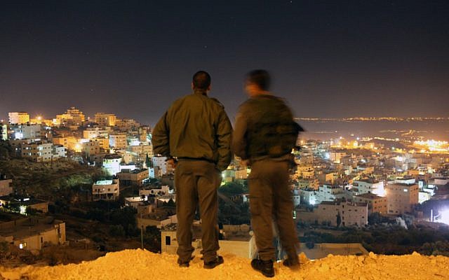 Illustrative photo of Border Policeman overlooking Jerusalem (illustrative photo credit: Kobi Gideon/Flash90)