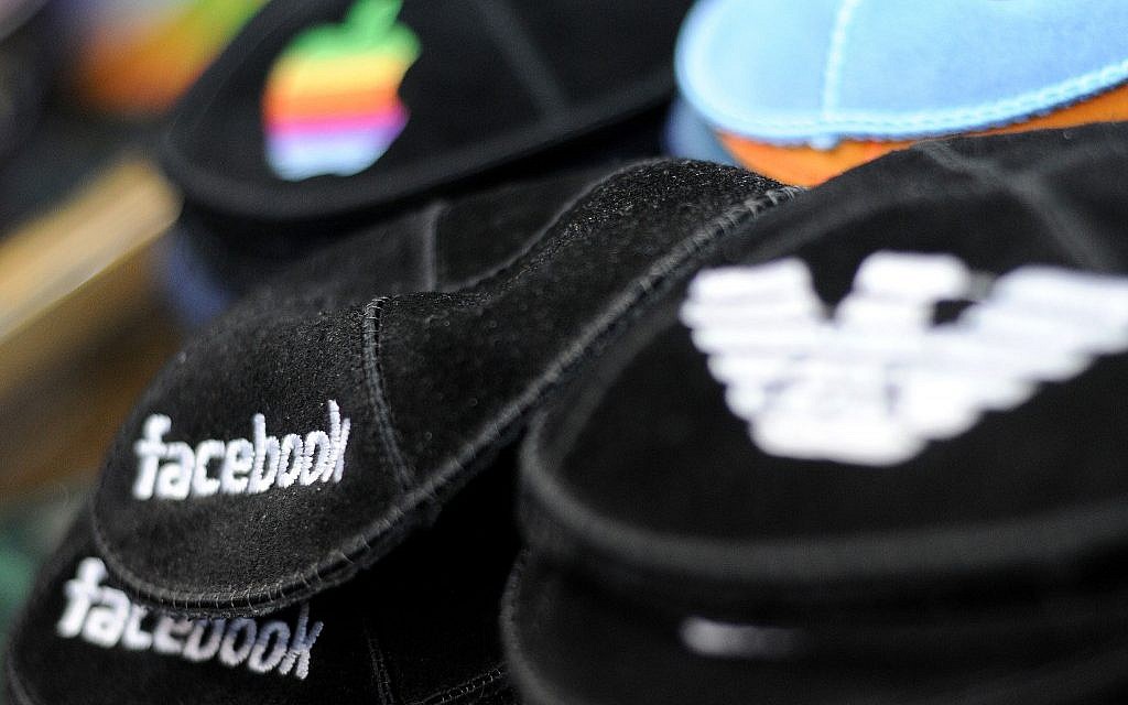 American brands including Facebook and Apple on black kippot in a Judaica shop on Ben Yehuda Street. (Photo credit: Sophie Gordon / Flash 90) American brands including Facebook and Apple on black kippot in a Judaica shop on Ben Yehuda Street. (Photo credit: Sophie Gordon / Flash 90)