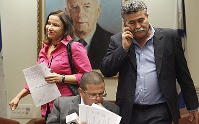 Amir Peretz stands next to Labor party leader Shelly Yachimovitch, November 2011 (photo credit: Miriam Alster/Flash90)