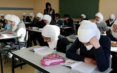 Young Arab girls seen studying during a lesson in the newly opened elementary school in the Arab neighborhood of Umm Tuba, in East Jerusalem in December 2011. (photo credit: Kobi Gideon/Flash90)