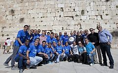 The players of Kiryat Shmona's unexpectedly successful soccer team visit the Western Wall in Jerusalem in April, 2012, after winning the country's premiere league championship. (photo credit: Yonatan Sindel/Flash90)
