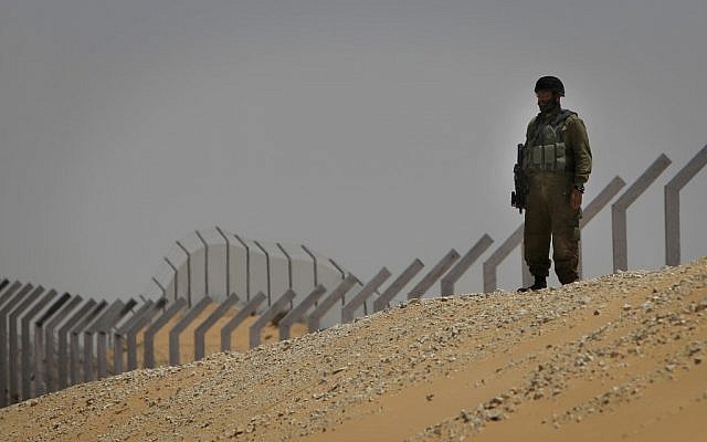 A soldier guarding the border with Egypt after a terror attack in June. (photo credit: Tsafrir Abayov/Flash90)