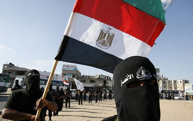 Militant Palestinians belonging to the Al-Ansar Brigades demonstrate in Rafah holding an Egyptian flag, July 7 (photo credit: Abed Rahim Khatib/Flash 90)