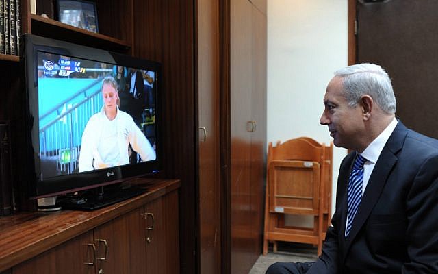 Prime Minister Benjamin Netanyahu watches judoka Alice Schlesinger compete at the Olympics in London on Tuesday, July 31 (photo credit: Amos Ben Gershom/GPO/Flash90)