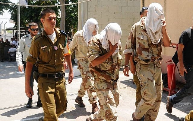 Suspects from the Kfir Brigade during their court hearing in Jaffa on Sunday. (photo credit: Yossi Zeliger/Flash90) Suspects from the Kfir Brigade during their court hearing in Jaffa on Sunday. (photo credit: Yossi Zeliger/Flash90)