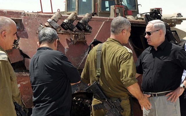 Prime Minister Benjamin Netanyahu, Chief of Staff Lt.-Gen. Benny Gantz, and Defense Minister Ehud Barak at Kerem Shalom on Monday. (photo credit: Avi Ohayon/GPO/Flash90)