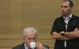 Bibi Netanyahu enjoys a rare quiet moment during the Knesset's meeting to review the state comptroller's report on the Carmel fire disaster (photo credit: Miriam Alster/FLASH90)