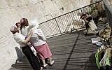 David Rubinger, a JerusaLENS contest mentor, photographs the Women of the Wall in the same pose as his famous 1967 paratrooper pictures (Oren Nahshon/Flash90)