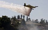 Firefighters fighting a blaze outside of Jerusalem.  Six fires were set Thursday across Israel and police suspect arson (photo credit:  Oren Nahshon/FLASH90)