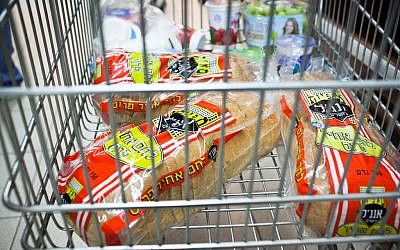 White bread in a shopping cart. hope they took out a loan for all that. (photo credit: Noam Moskowitz/Flash90)