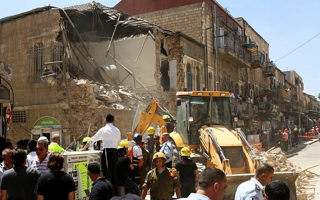 Rescue and medical personnel at the scene where the top floor of a building which was under construction in the ultra-Orthodox neighborhood of Geula in Jerusalem collapsed, injuring two workers (photo credit: Yonatan Sindel/Flash90)