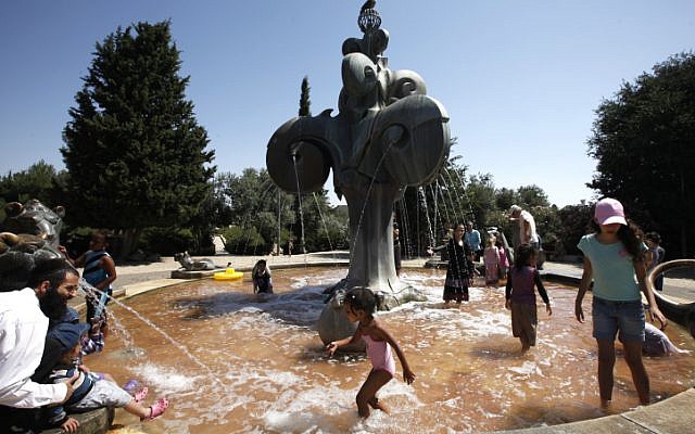 Children in Jerusalem cool off during a hot August day (photo credit: Miriam Alster/Flash90)