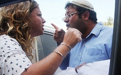 Noa Rothman, granddaughter of assassinated prime minister Yitzhak Rabin, argues with right wing activist Itamar Ben Gvir on Tuesday (photo credit: Roni Schutzer/Flash90)