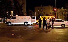 Police and medical personnel at the scene of the hit-and-run accident that killed three pedestrians in Netanya Friday night (photo credit: Omer Messinger/Flash90)