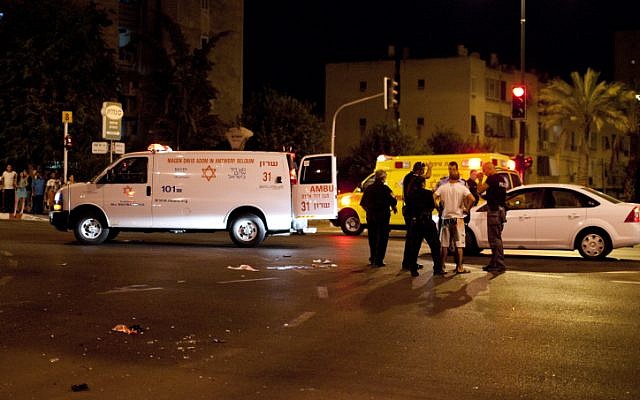 Police and medical personnel at the scene of the hit-and-run accident that killed three pedestrians in Netanya, August 17 (photo credit: Omer Messinger/Flash90)
