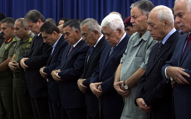 PA President Mahmoud Abbas prays alongside Palestinian officials during the festival of Eid Al-Fitr, August 19 (photo credit: Issam Rimawi/Flash 90) PA President Mahmoud Abbas prays alongside Palestinian officials during the festival of Eid Al-Fitr, August 19 (photo credit: Issam Rimawi/Flash 90)