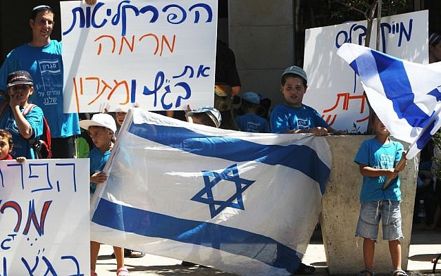 Protesting against the planned evacuation of Migron outside the Justice Ministry on August 23 (photo credit: Miriam Alster/FLASH90)
