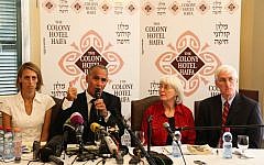 Hussein Abu Hussein, surrounded by Rachel Corrie's family, speaking to reporters Tuesday. (photo credit: Avishag Shaar Yashuv/Flash90)
