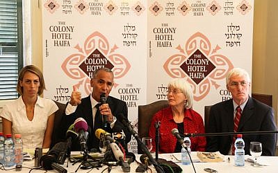 Hussein Abu Hussein, surrounded by Rachel Corrie's family, speaking to reporters Tuesday. (photo credit: Avishag Shaar Yashuv/Flash90)