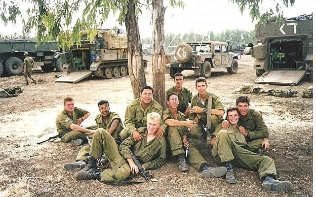 Guy Hever (fifth from right, with glasses) and friends several weeks before his disappearance in 1997. (Courtesy of Rina Hever) Guy Hever (fifth from right, with glasses) and friends several weeks before his disappearance in 1997. (Courtesy of Rina Hever)