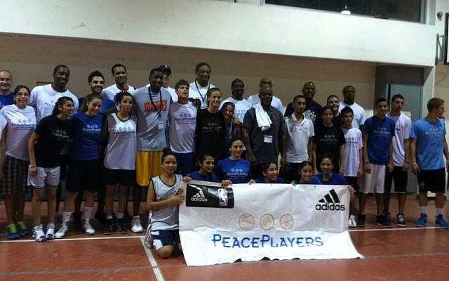 Basketball brings former NBA players together with Jewish and Arab youth.
