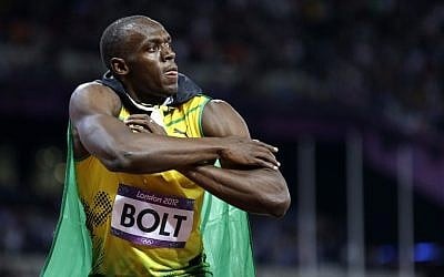 Jamaica's Usain Bolt reacts to his win in the men's 100-meter final at the Olympic Games on Sunday (photo credit: AP/Anja Niedringhaus)