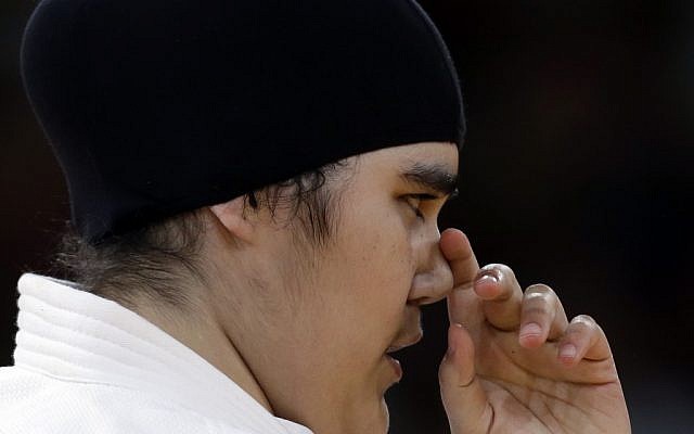 Saudi Arabia's Wojdan Shahrkani reacts during the women's 78-kg judo competition against Puerto Rico's Melissa Mojica at the 2012 Summer Olympics, Friday, Aug. 3 (photo credit: AP/Paul Sancya) Saudi Arabia's Wojdan Shahrkani reacts during the women's 78-kg judo competition against Puerto Rico's Melissa Mojica at the 2012 Summer Olympics, Friday, Aug. 3 (photo credit: AP/Paul Sancya)