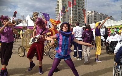Street performers at the Olympic village, August 27 (photo credit: Leah Schneider/courtesy ISAP)