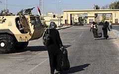 Palestinians walk toward the Egyptian border crossing with Gaza at Rafah, August 2012 (photo credit: AP)