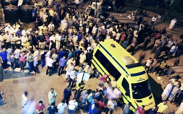 Egyptians stand outside a hospital in El-Arish, northern Sinai, following the terrorist attack on August 5, 2012 (photo credit: AP photo) Egyptians stand outside a hospital in El-Arish, northern Sinai, following the terrorist attack on August 5, 2012 (photo credit: AP photo)